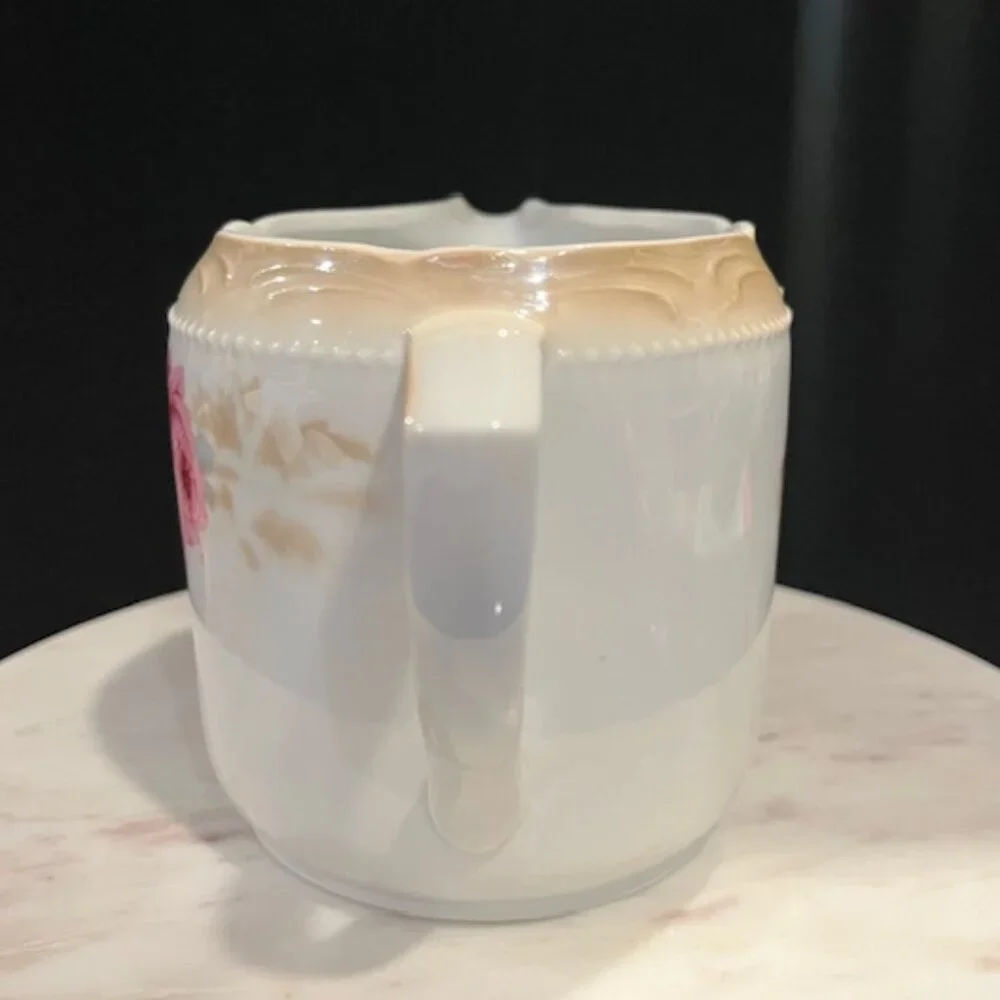 German Porcelain Large Creamer with Roses and Beaded Handle